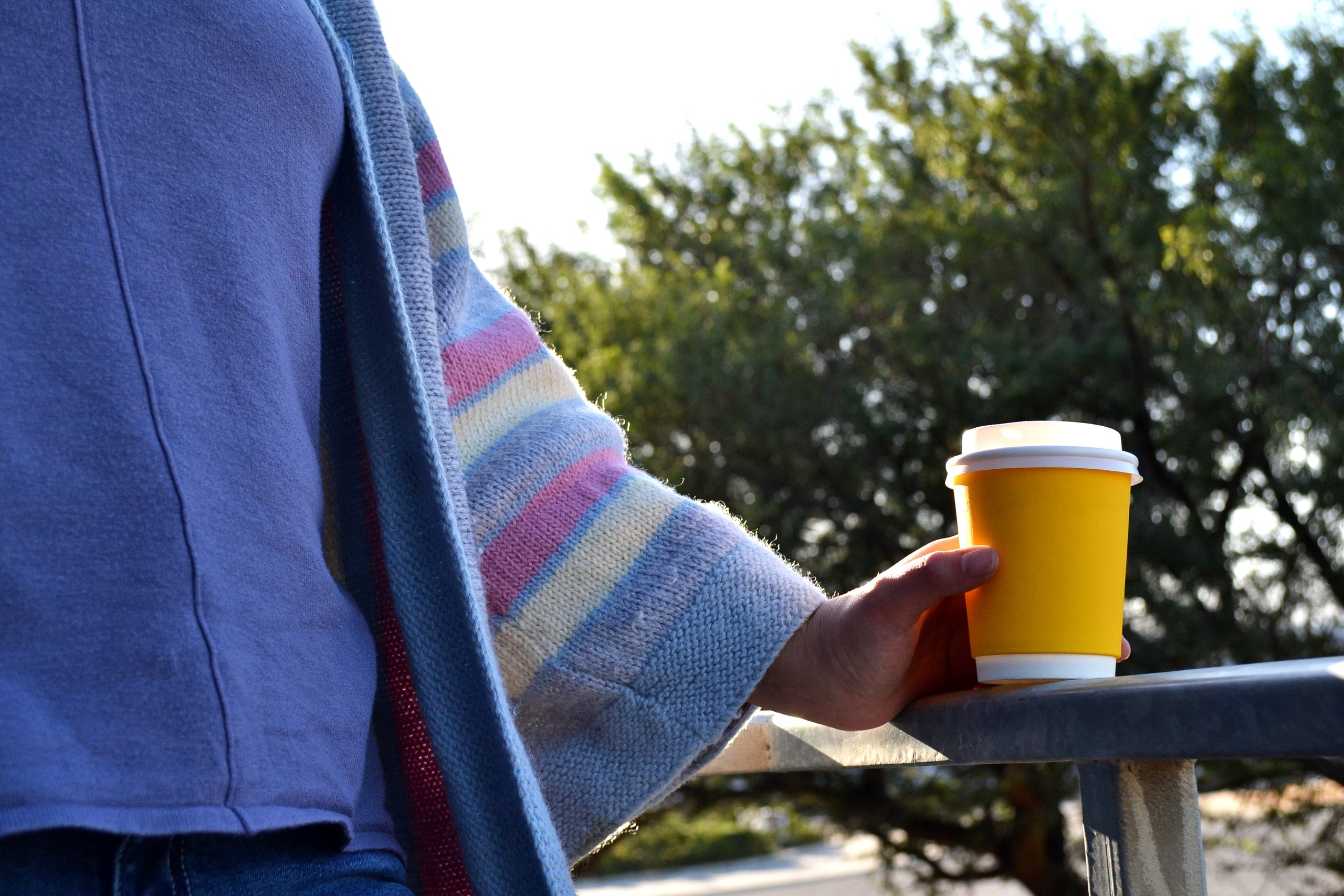 woman holding drink cup